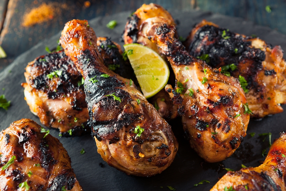 Grilled jerk chicken with lime on top
