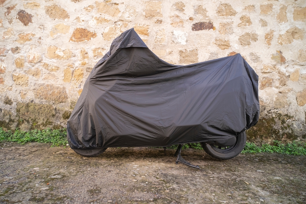 Motorcycle under a cover parked